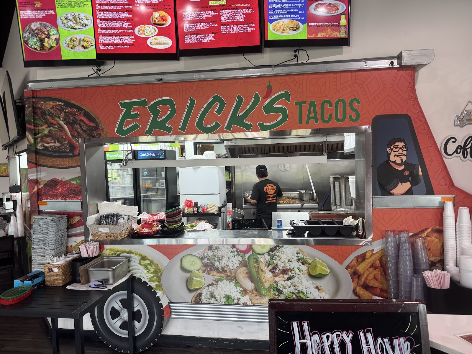 Erick's Tacos counter with hand-painted signage