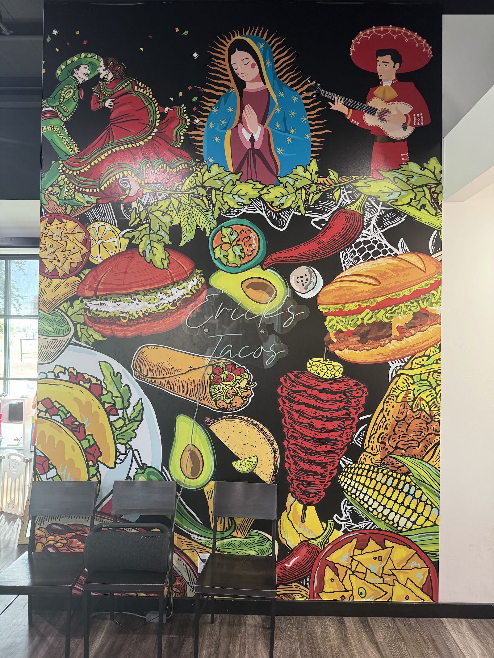 Colorful mural of Mexican food and culture inside Erick's